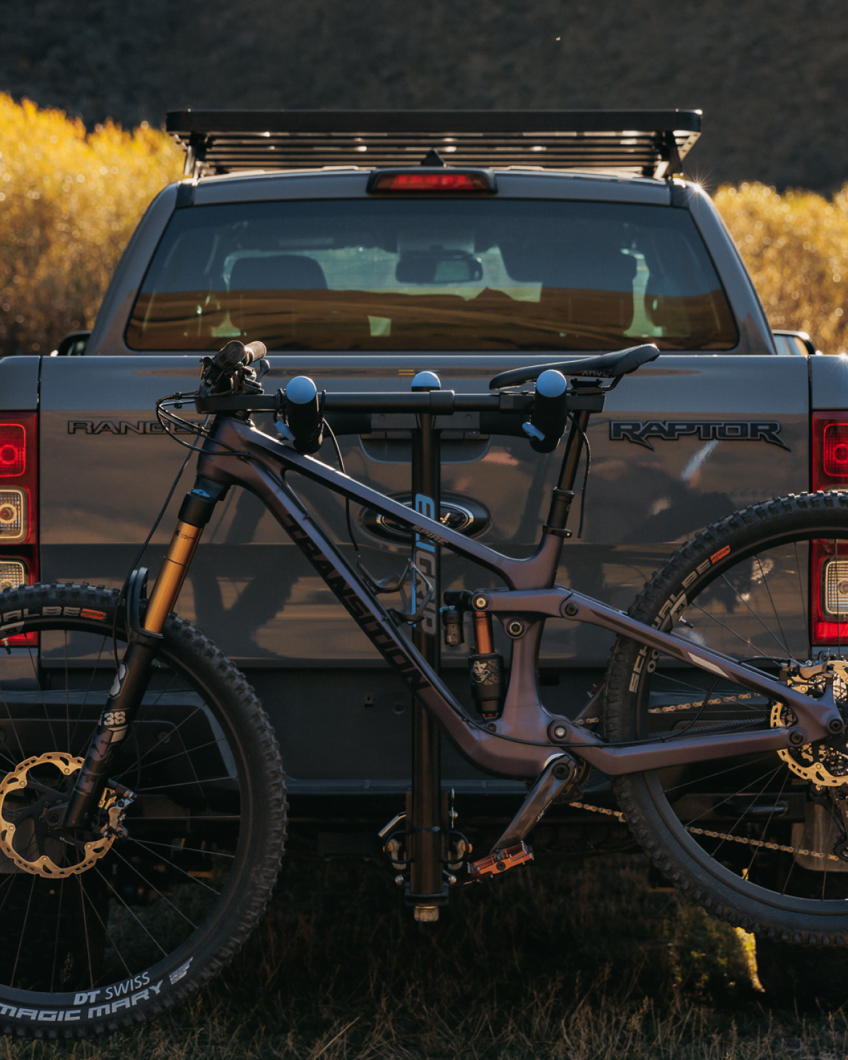A rear view of a bike buddy being used as a top tube for a mountain bike on an advantage prong bike rack