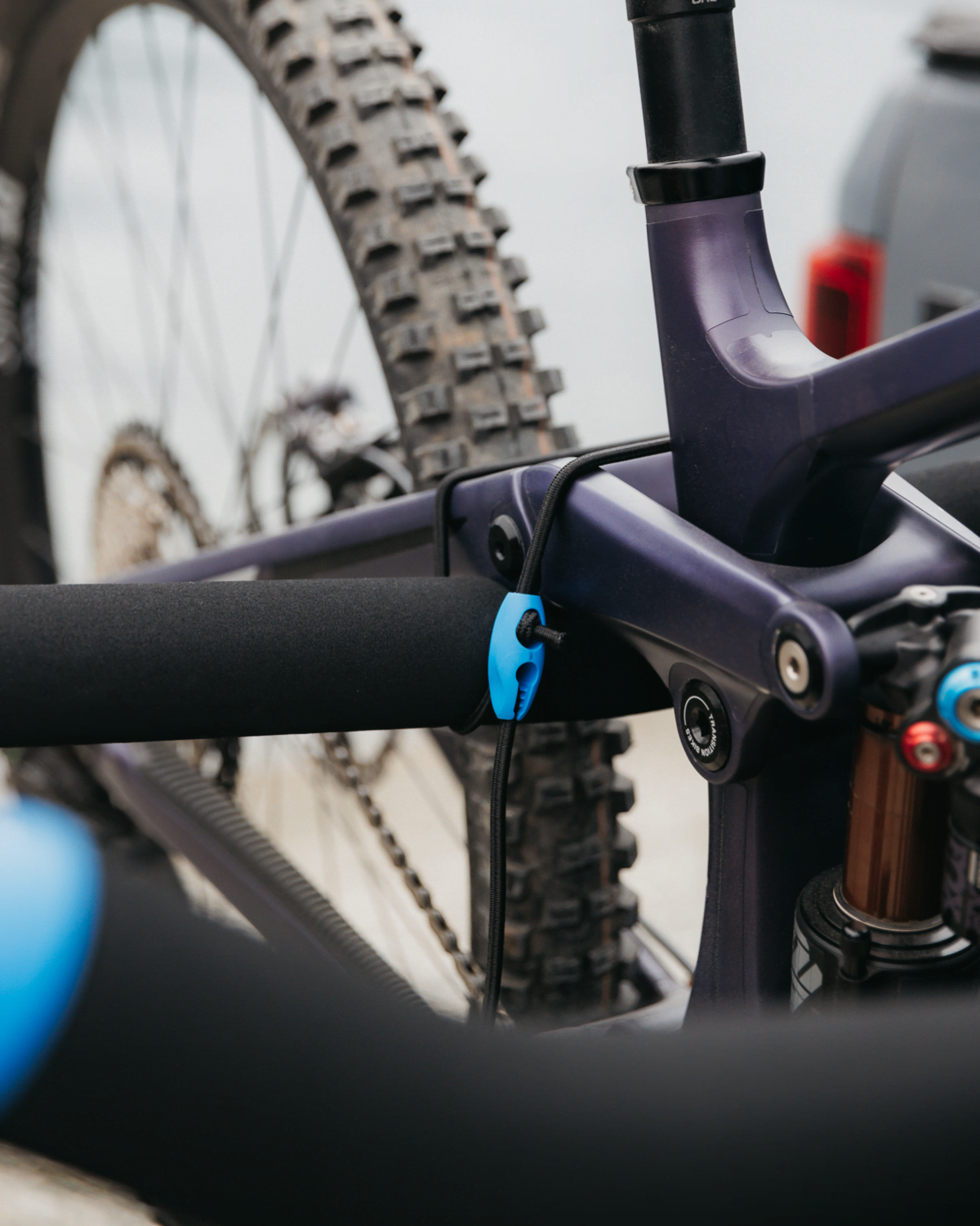 A close view of an Ezigrip Bungee clip on an Advantage prong bike rack
