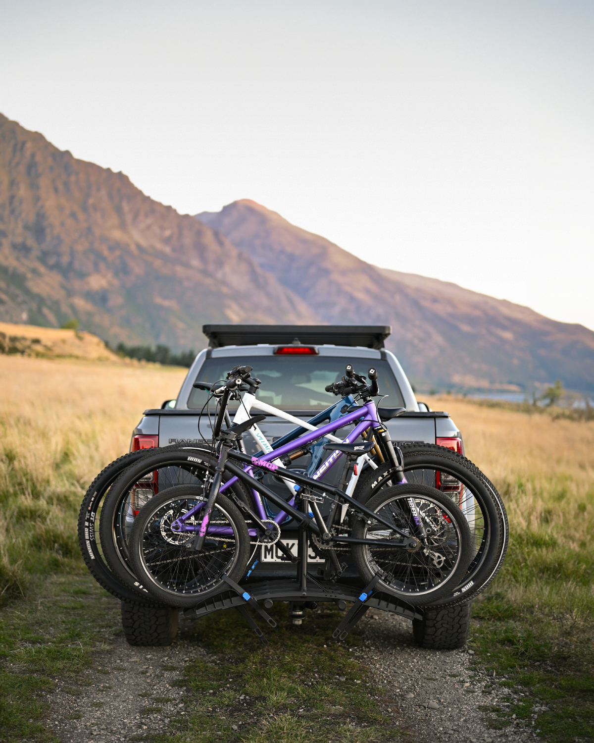 An Ezigrip Enduro 4 bike rack is mounted to a ute with 4 bikes loaded and its being viewed from the rear to show how wide the bike rack is