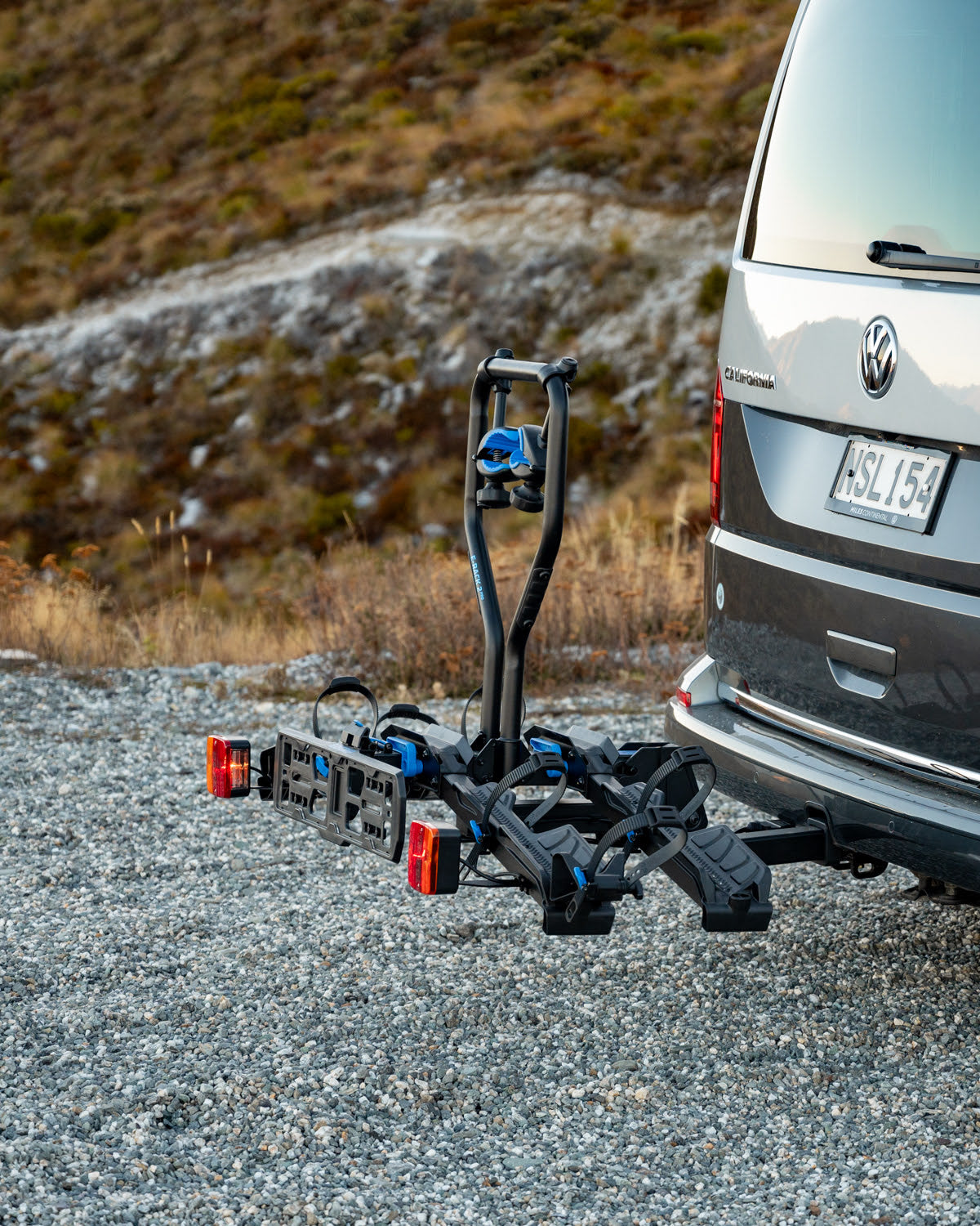 The Ezigrip E-Rack 2 Pro hitch mounted ebike rack is mounted to the hitch of a van.