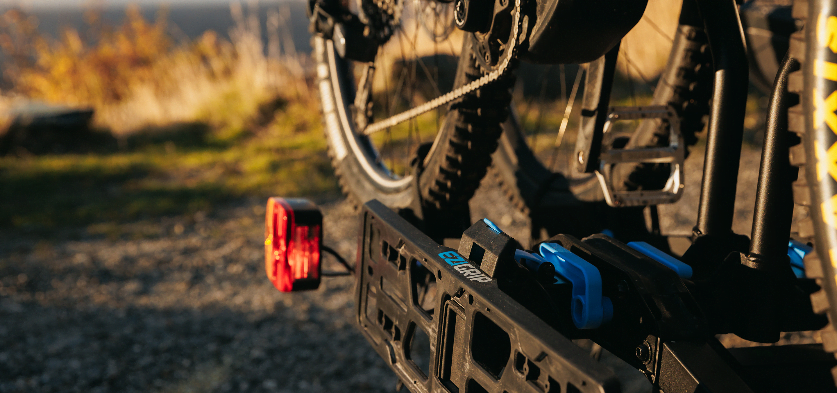 A view of the Ezigrip E-Rack 2 bike rack with two electric bikes loaded with the sun shining on the bike rack