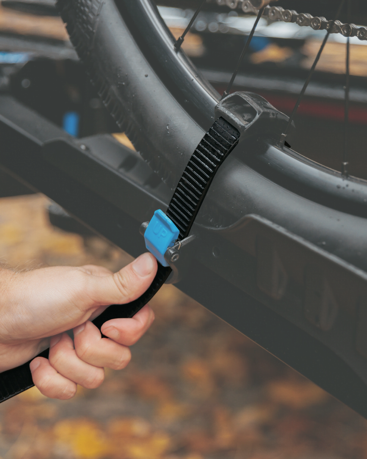 A ratchet strap restraining a wheel on the E-rack 2 bike rack