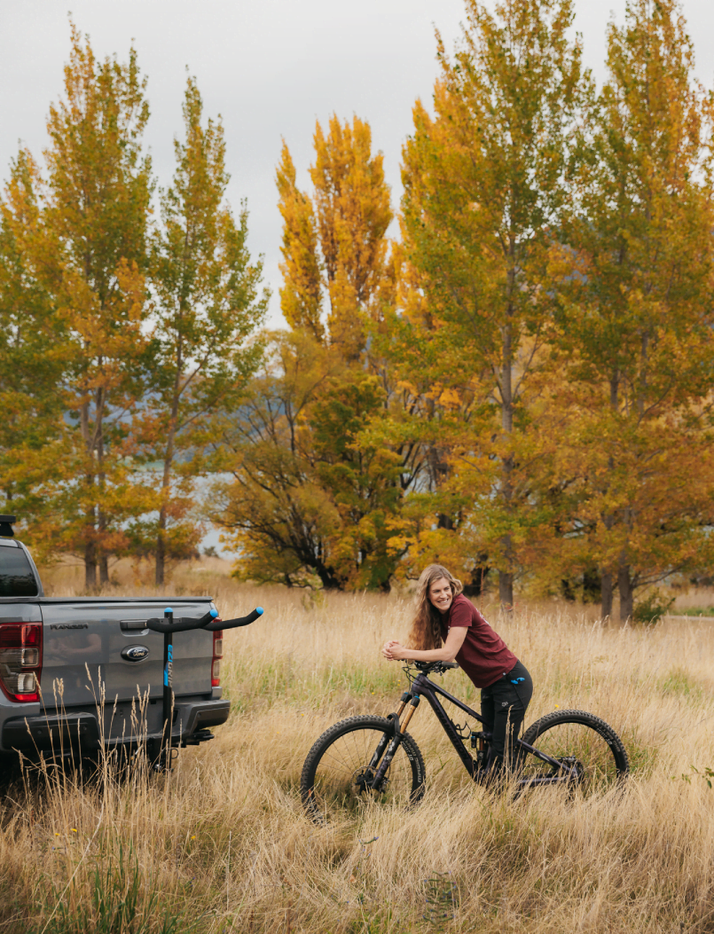 A woman is preparing to load her mtb onto an Advantage 4 bike rack
