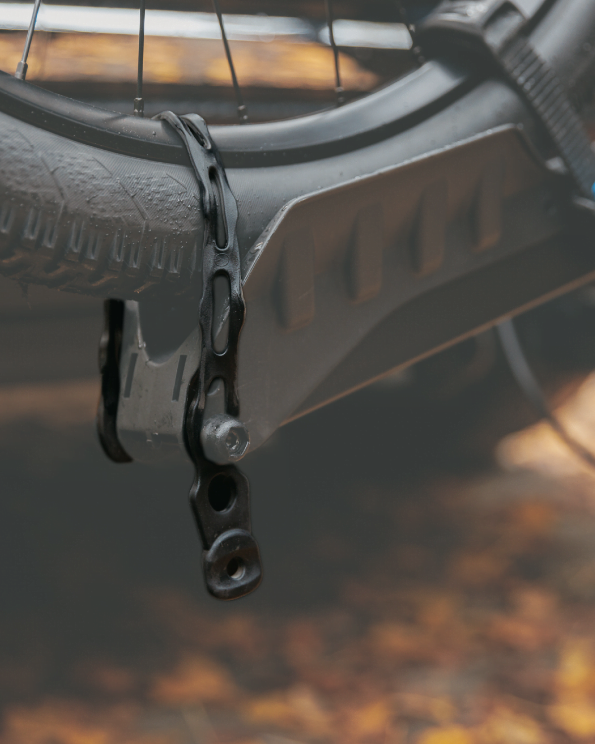 A webbing strap highlighted restraining the front tire of an ebike on the E-Rack 2 bike rack